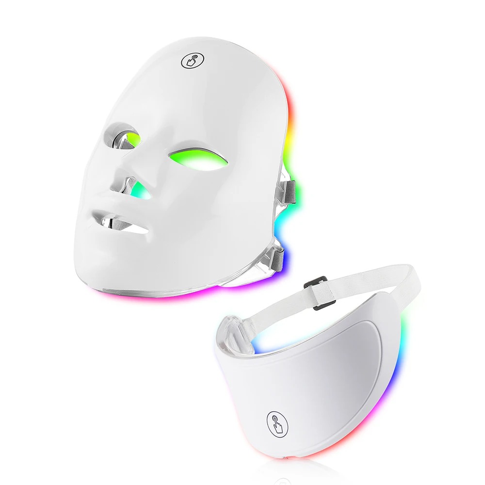 White 7-color LED light therapy face mask with detachable neck panel glowing in rainbow light
